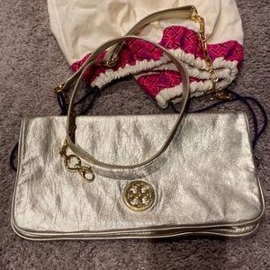 Gold Tory Burch purse with gold leather chain straps. With cloth bag